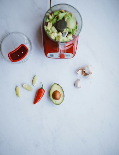 blender filled with avocado