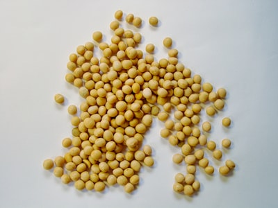 yellow beans on white surface